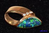 lot 31 image: 14K gold pendent with diamond. The diamond wa...