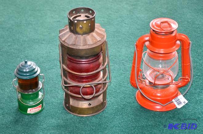 lot 54 image: Orange keroseen lamp, Red candle lamp, Green ...