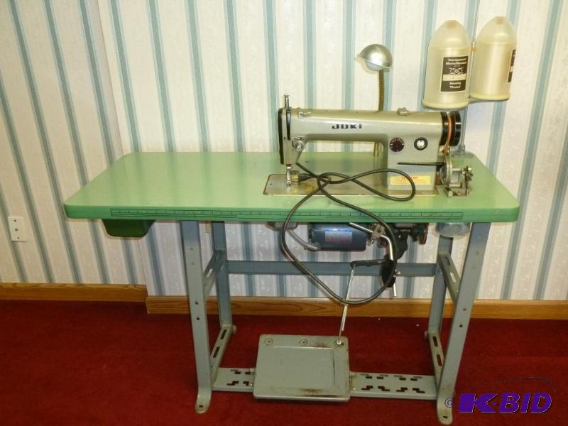 lot 33 image: Juki Commercial Sewing Machine and stand, pow...