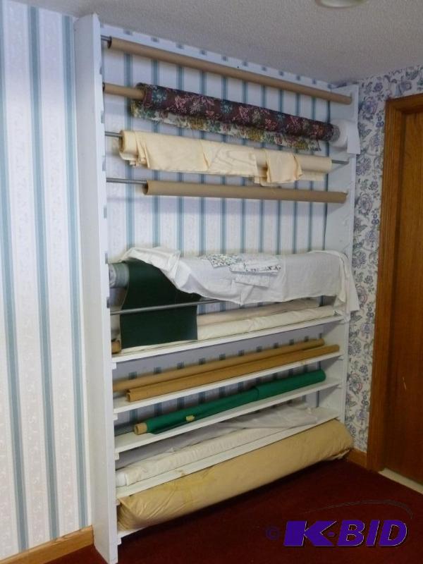 lot 37 image: Large wooden fabric roll rack that measures 7...