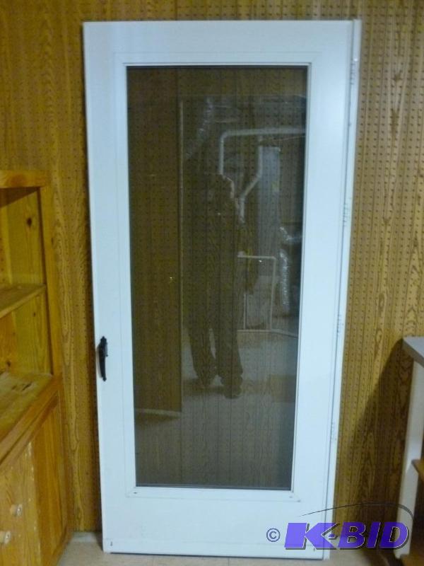 lot 49 image: Heavy duty 36" full glass storm door wit...