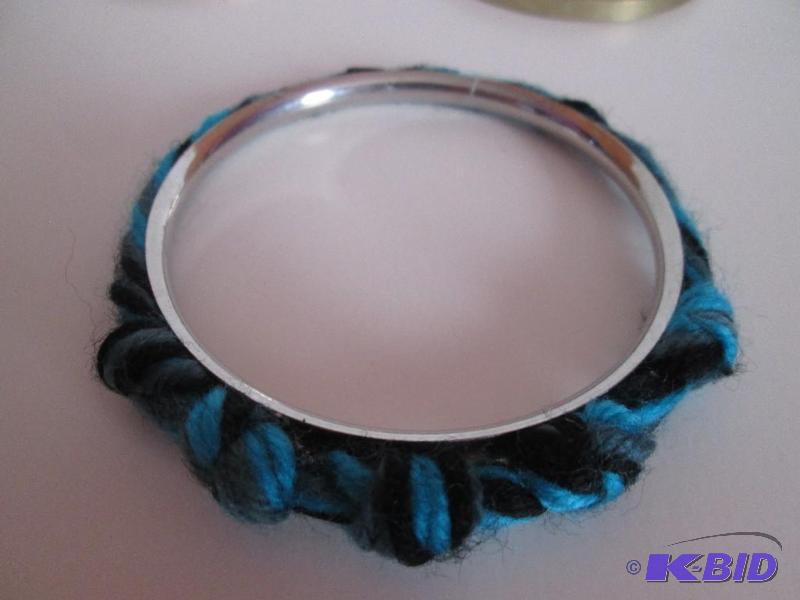 lot 103 image: metal framed blue,gray,and black string bracl...