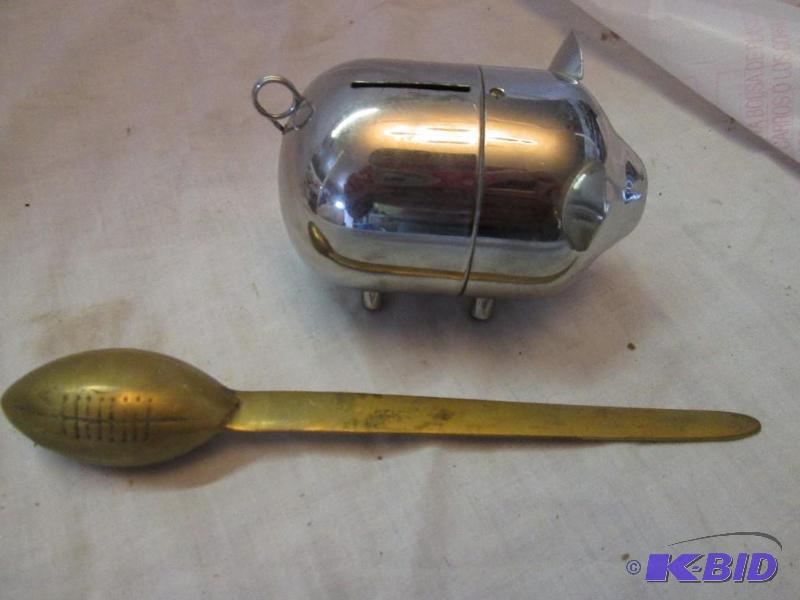 lot 13 image: Metal piggy bank with screw on the bottom to ...