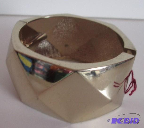 lot 134 image: Gold colored thick braclet...