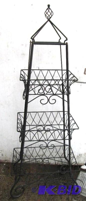 lot 20 image: Decorative metal plant or garden stand, measu...
