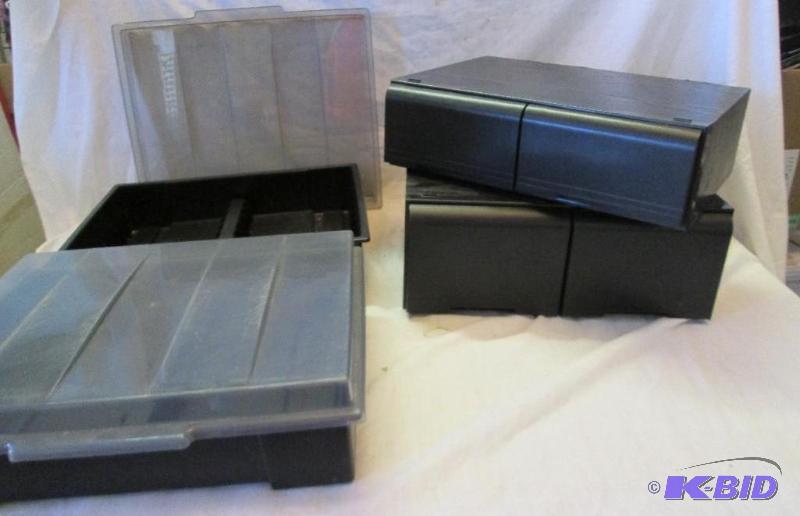 lot 45 image: two plastic and two sliding dware VHS holder...