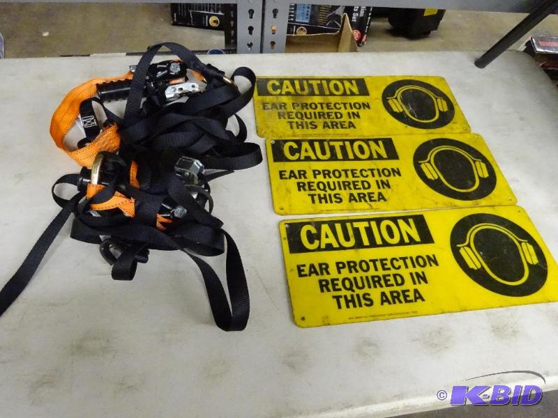 3 caution signs and 2 tie down straps