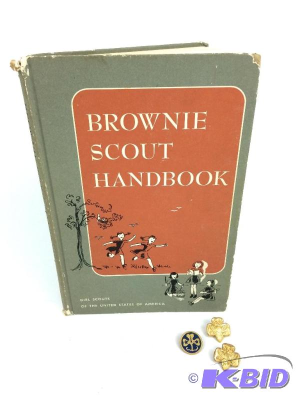 lot 30 image: Brownie Scout Handbook with 2 vintage pins