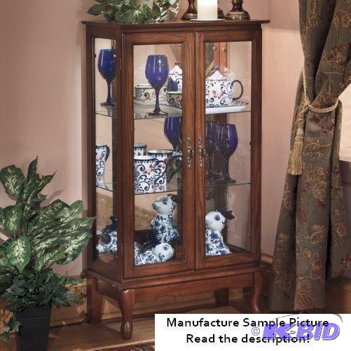 lot 71 image: Two Door Lighted Cabinet Exclusive - This two...