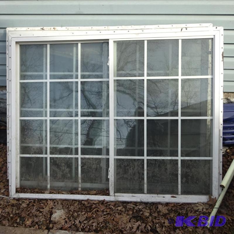 Vinyl window. Slider with grids. 59 x 48...