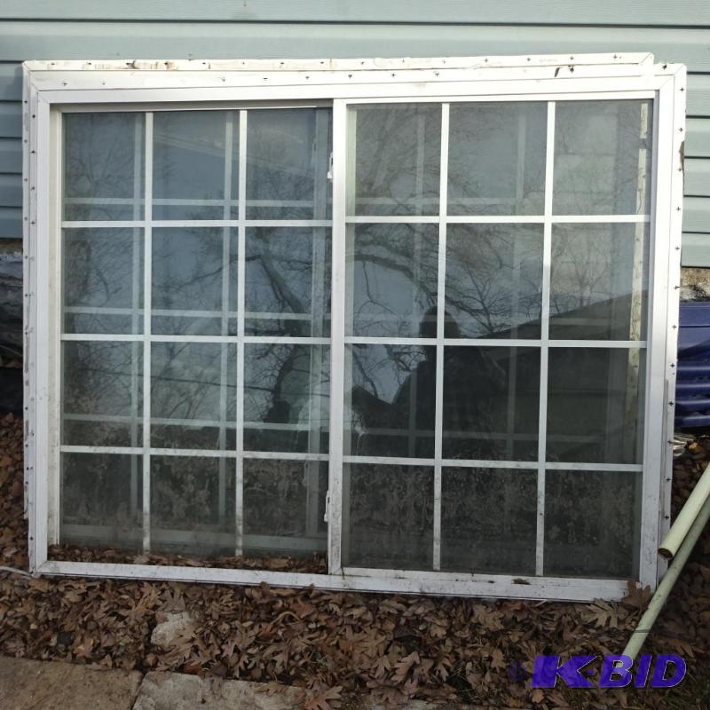 Vinyl window. Slider with grids. 59 x 48...