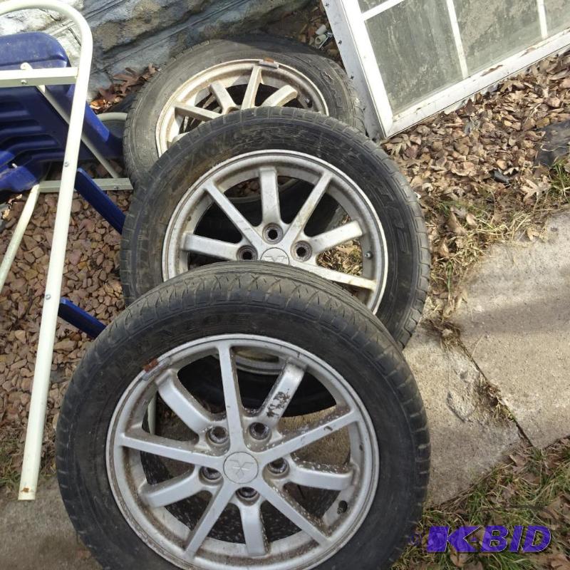 3 Mitsubishi tires and aluminum rims. 1 rim h...