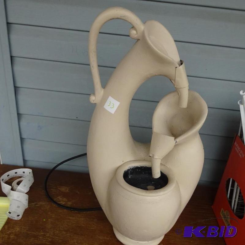 Plastic water fountain. 24&quot...