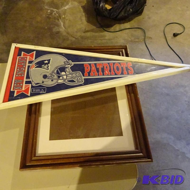 New England pennant framed. 21 x 17. Wood pic...