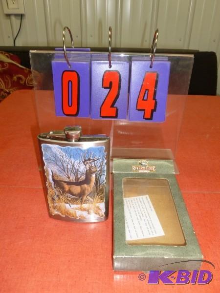 lot 24 image: Rivers edge alcohol flask with deer scene. Ne...