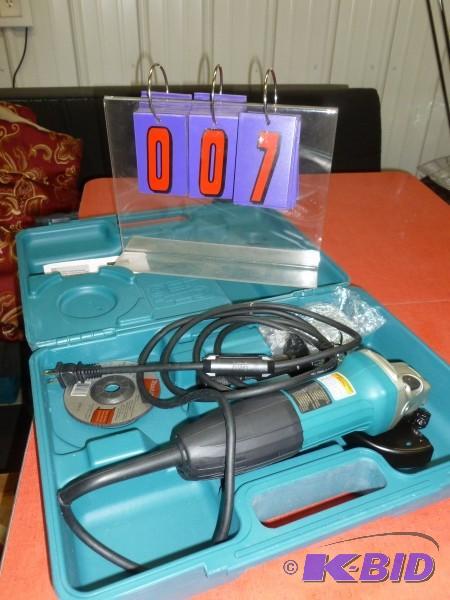 lot 7 image: Makita 4" electric grinder. With case as...