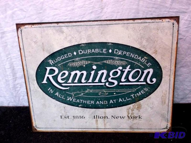 lot 10 image: Collectable Remington sign measuring 16"...