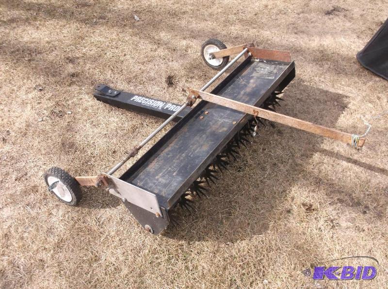 lot 3 image: Precision Pro lawn aerator had wheels added t...