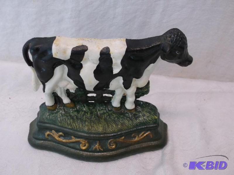 lot 83 image: Collectable cast iron door stop measuring 6 3...