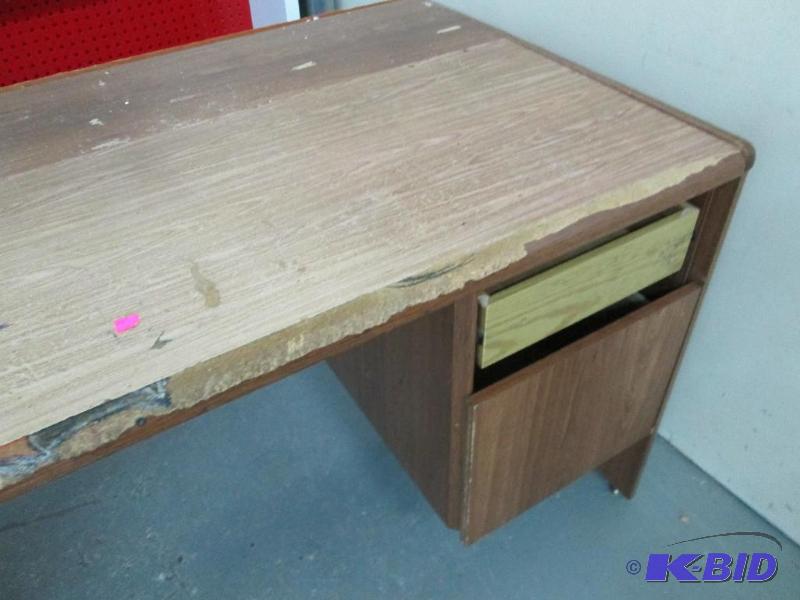 lot 12 image: Used desk, top is 62 x 30 and stands 30 inche...