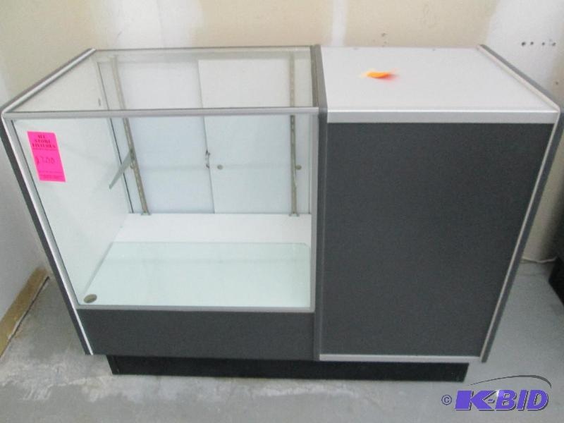 lot 4 image: Glass display with rear storage cubby. Top is...