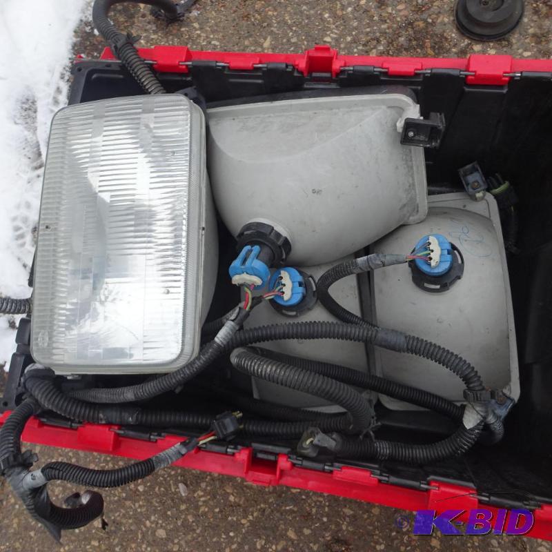 lot 18 image: 4 headlights off of P-30 truck chassis. Utili...