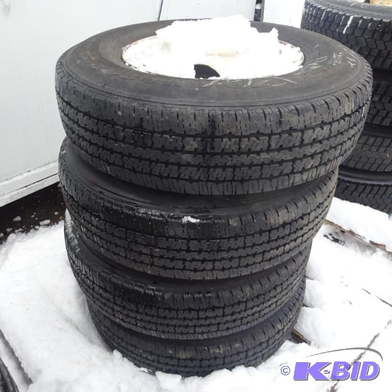 lot 5 image: Firestone LT215 85R16 tires and rims. Load ra...