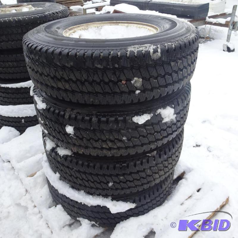 lot 8 image: Bridgestone LT235 85R16 tires and rims. Came ...