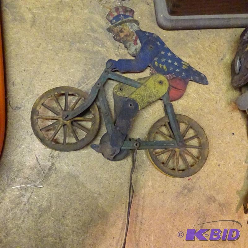 lot 175 image: Vintage Uncle Sam on a Bicycle. Moveable...