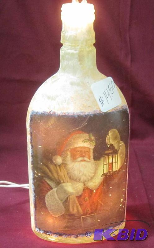 lot 496 image: NEW  8 12 High Lighted Electric Lamp Bottle with Santa with Lantern