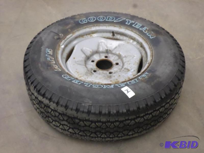 lot 14 image: 5-Lug Steel Wheel With Like New Goodyear Wran...