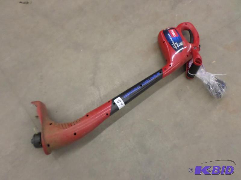 lot 57 image: Toro 12Volt Cordless Trimmer With Charger...