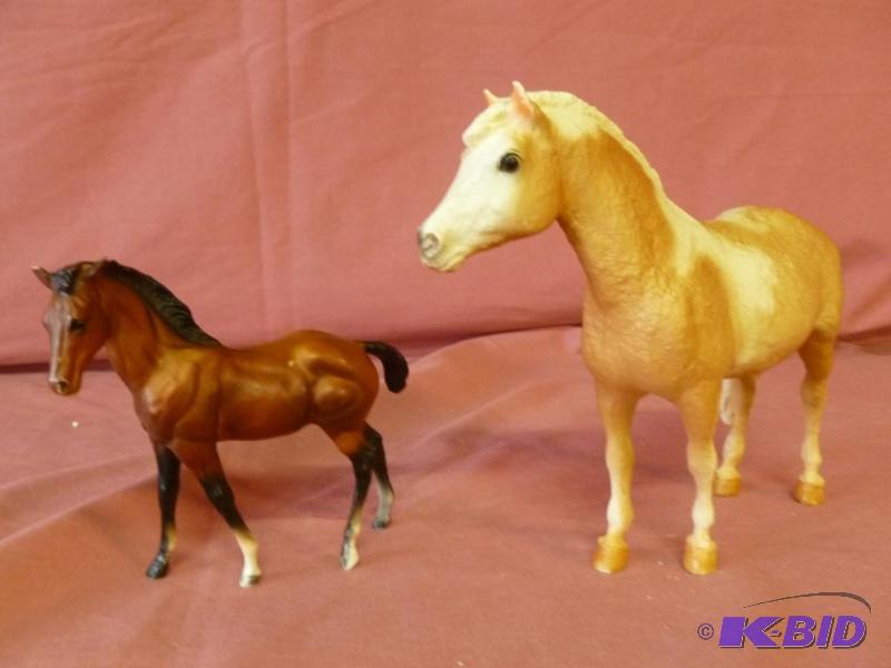 lot 85 image: Lot of two collectible horses that includes a...