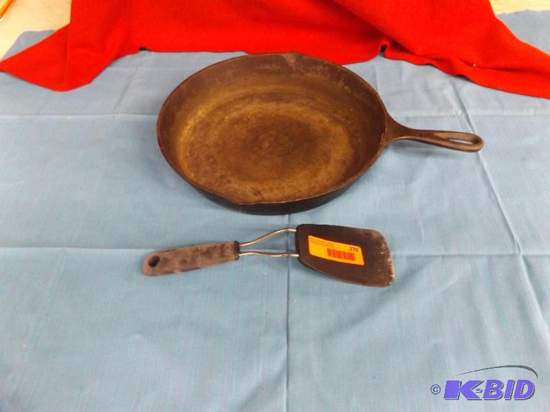 lot 279 image: Lodge USA 10SK Cast Iron Frying pan and spatu...