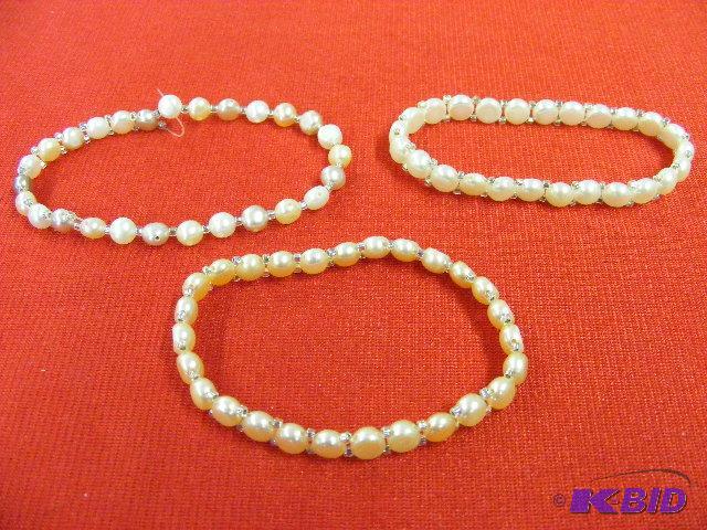 lot 29 image: Set of three Genuine FW Pearl bracelets...