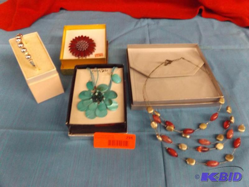 lot 294 image: Lot of necklaces, flower brooch, and bracelet...