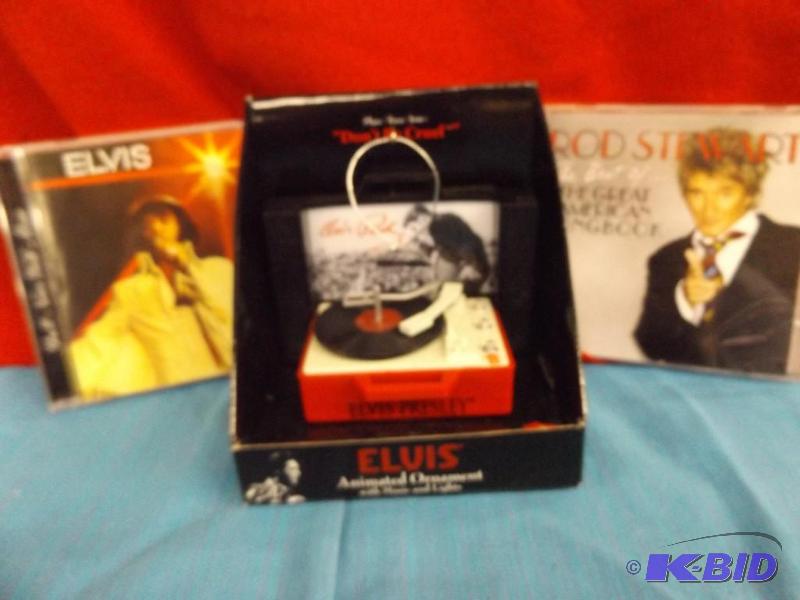 lot 42 image: Elvis Presley tree ornament, Rod Stewart CD, ...