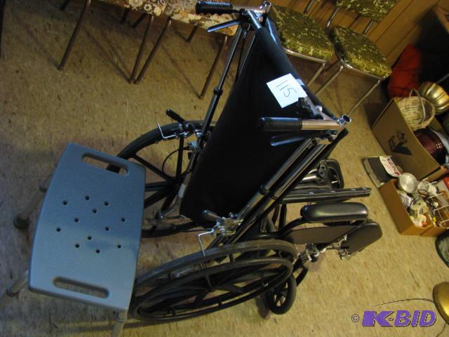 lot 115 image: wheelchair with a tilting back, elevatingrem...