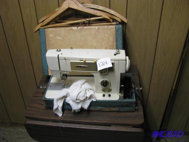 lot 124 image: drop leaf formica table sewing machine and so...
