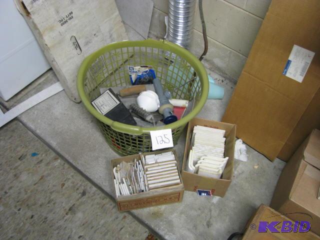 lot 125 image: tile pieces and plumbing supplies...