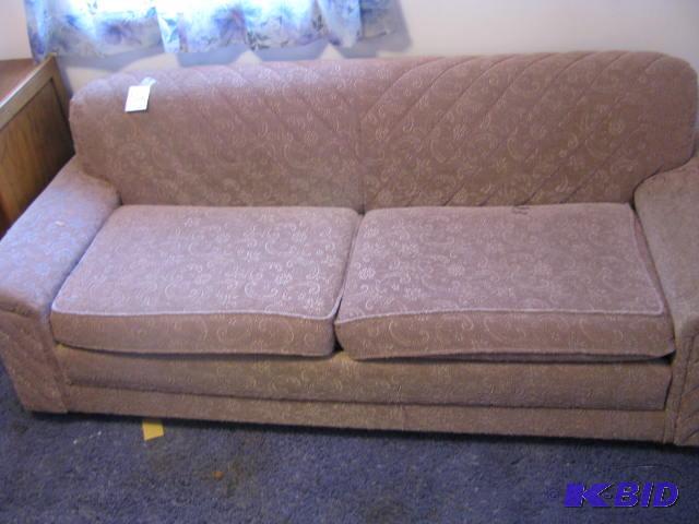 lot 52 image: Vintage mauve floral pattern sofa with a hide...