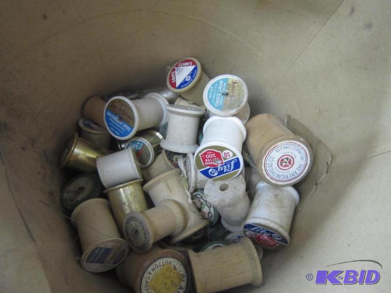 Bucket of Wood Thread Spools