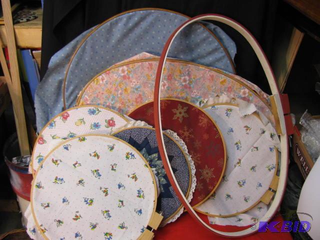 three large vintage embroidery hoops and five...