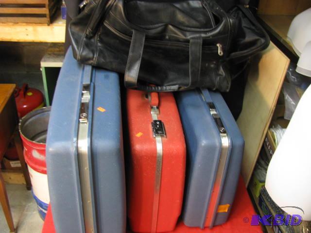 vintage hard sided luggage and large black ca...