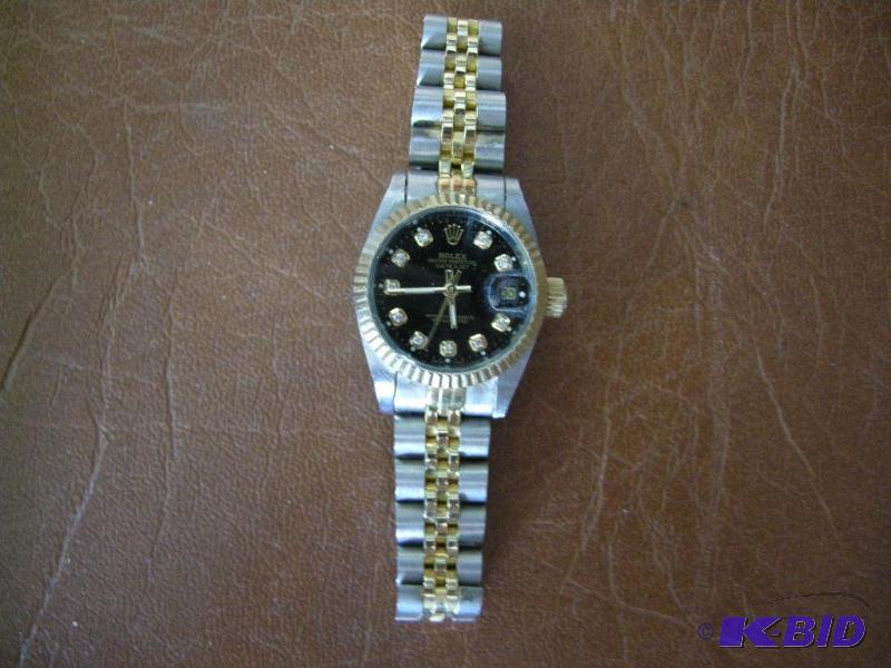 lot 16 image: Womens faux Rolex watch