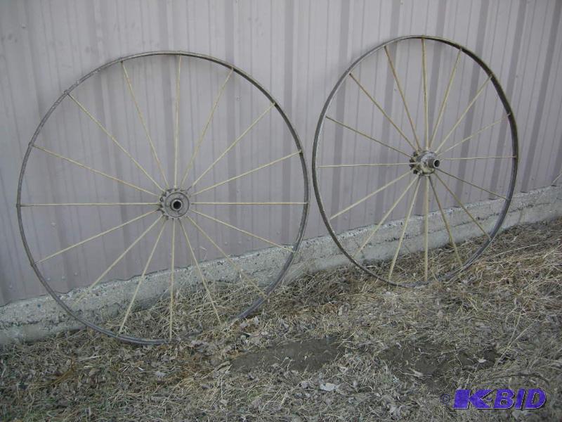 lot 4 image: Antique iron wagon wheels