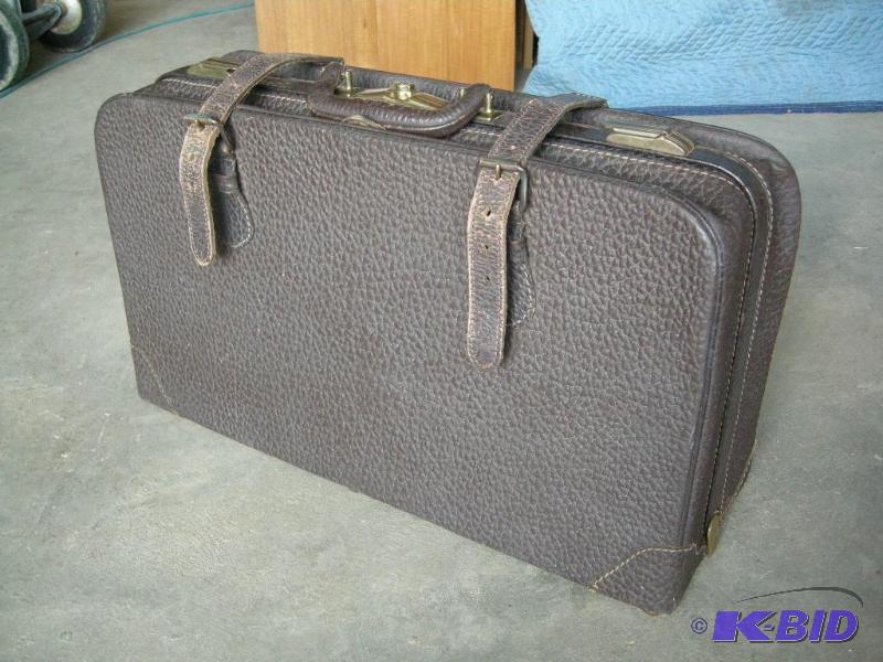 lot 68 image: Vintage cowhide suitcase