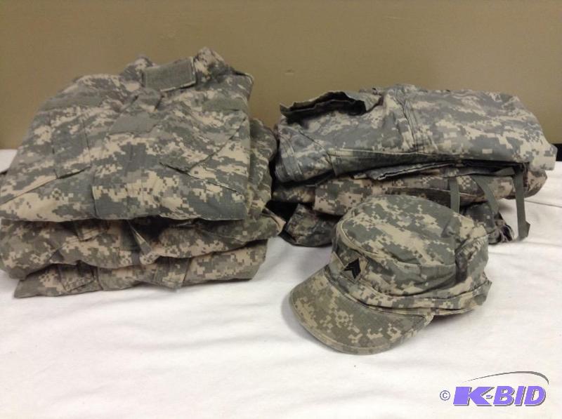 lot 39 image: Lot of military combat uniform camo -3 shirts, 3 pants and a patrol cap