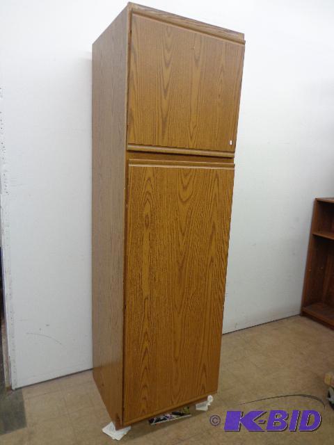lot 16 image: Pantry Cabinet   2 doors  pull out shelves  7...