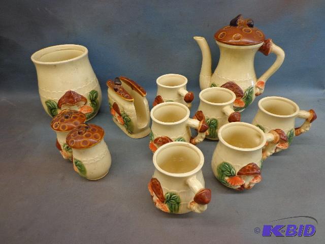 lot 43 image: Mushroom Set   Pitcher, canister, 7 cups and ...